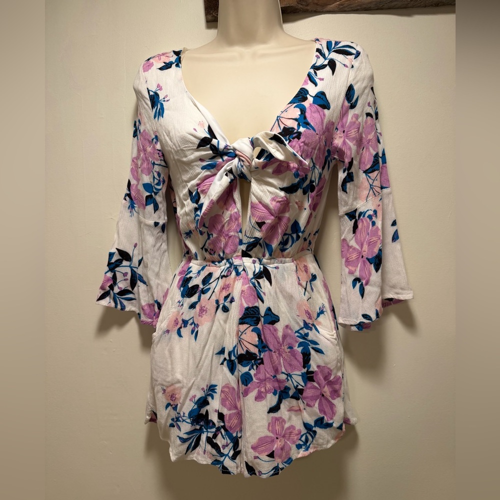 Charolette Russe floral Romper
Size S